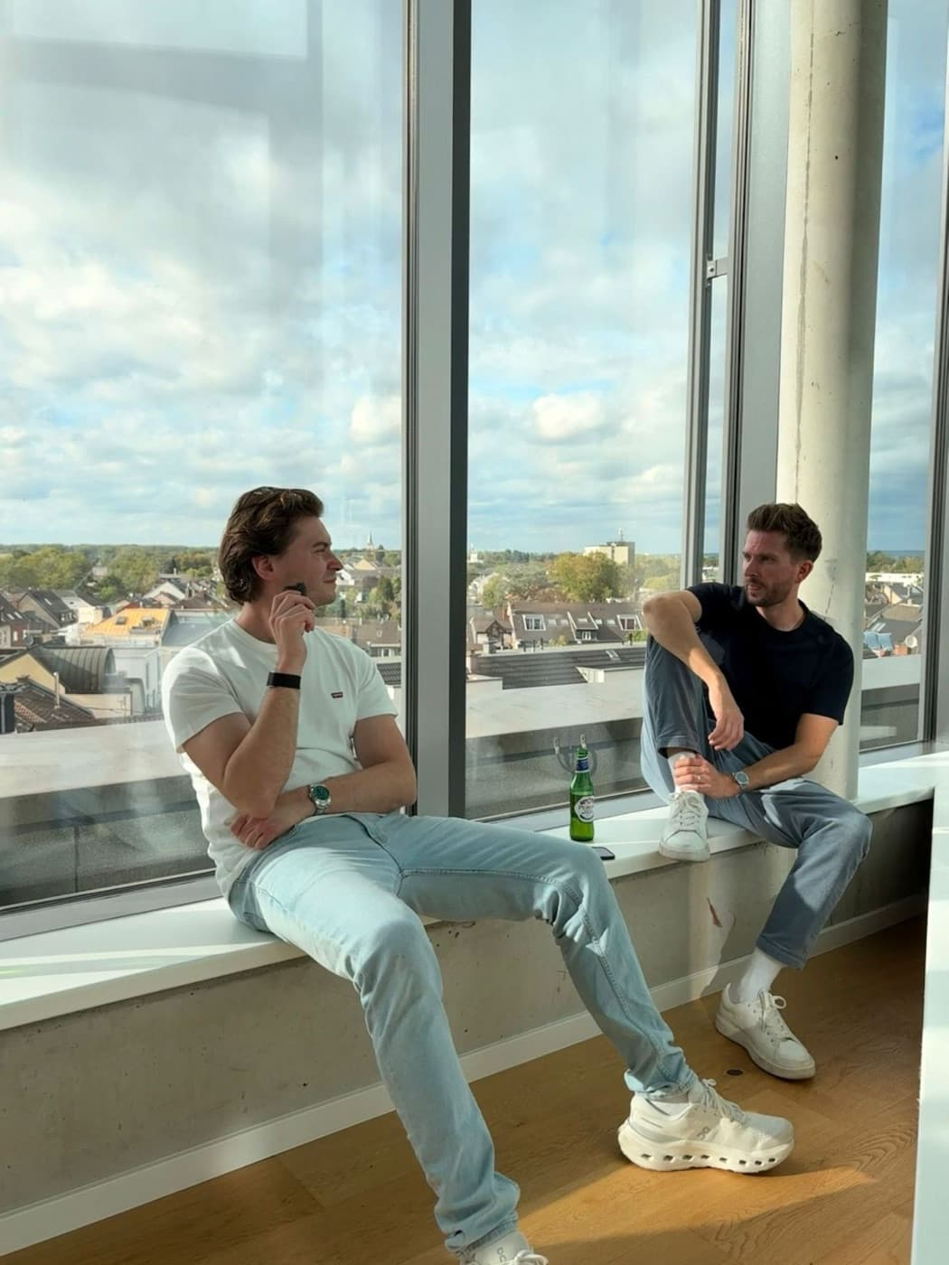 The founders by the office window
