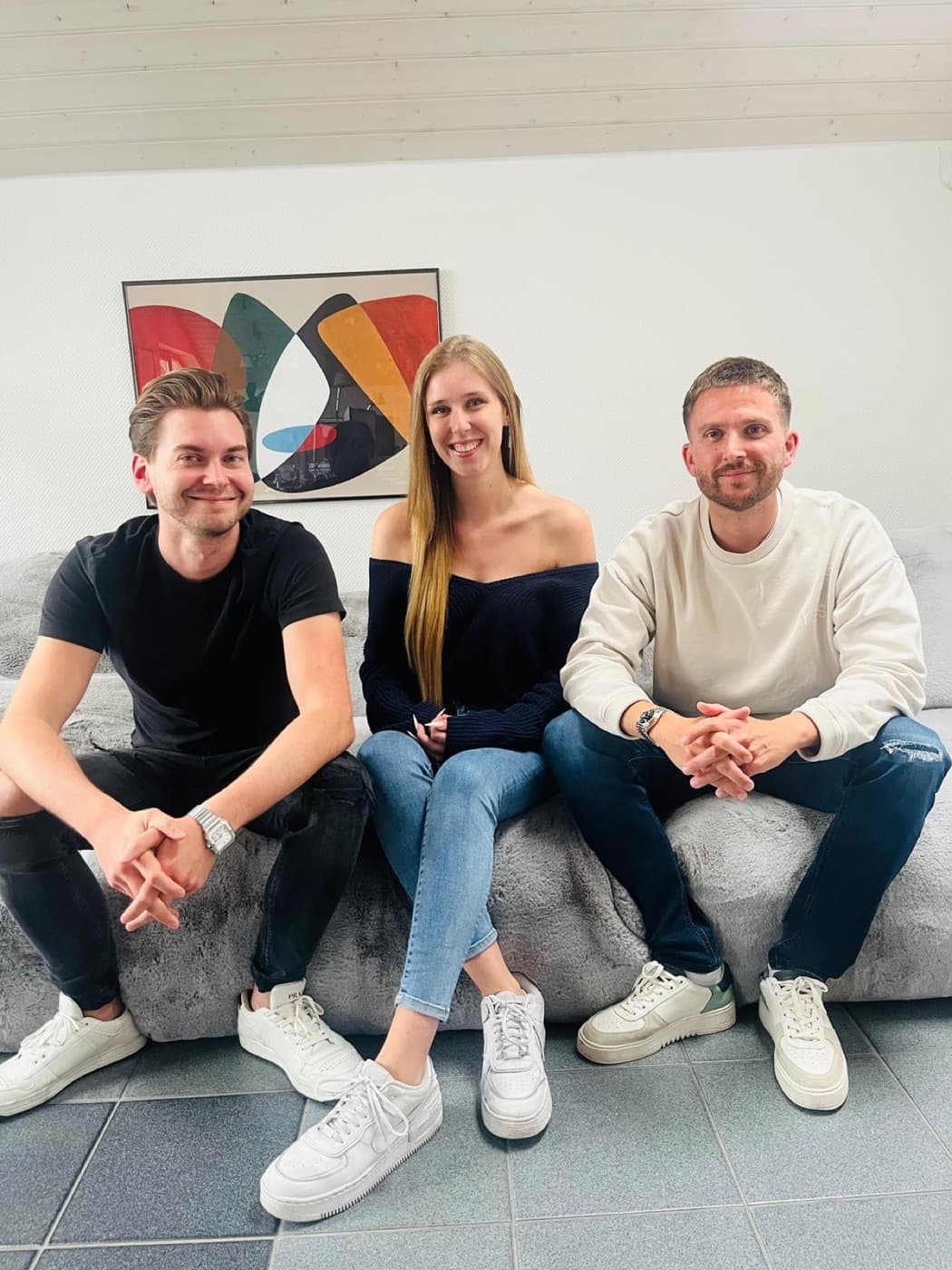 Three team members on the office sofa