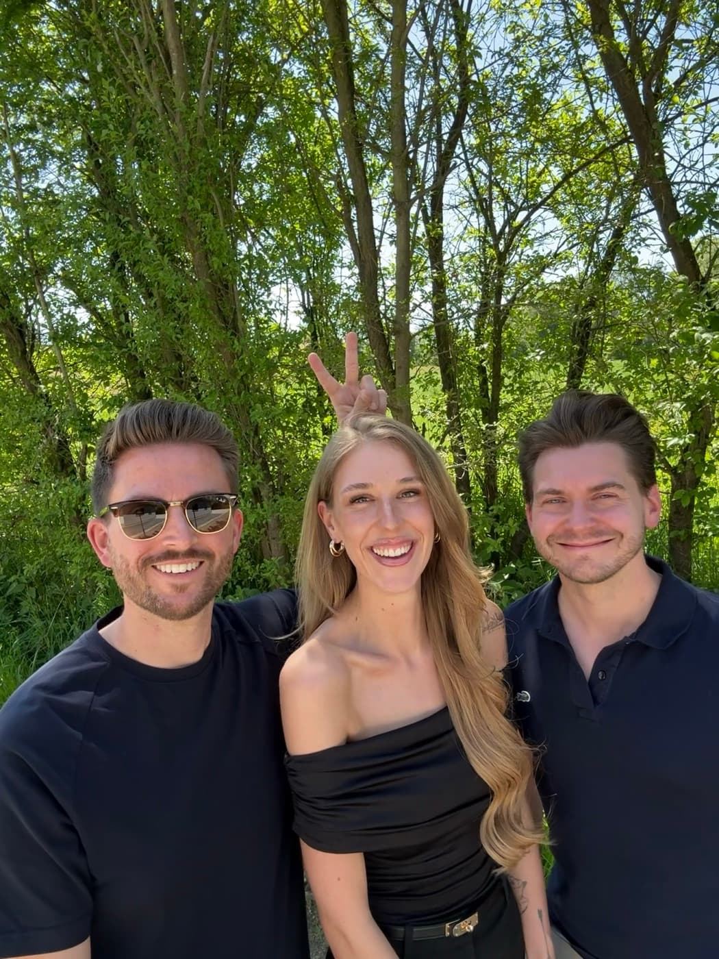 Three team members outdoors